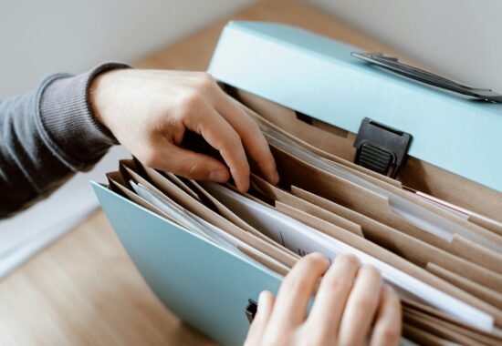 Person looking through paper files